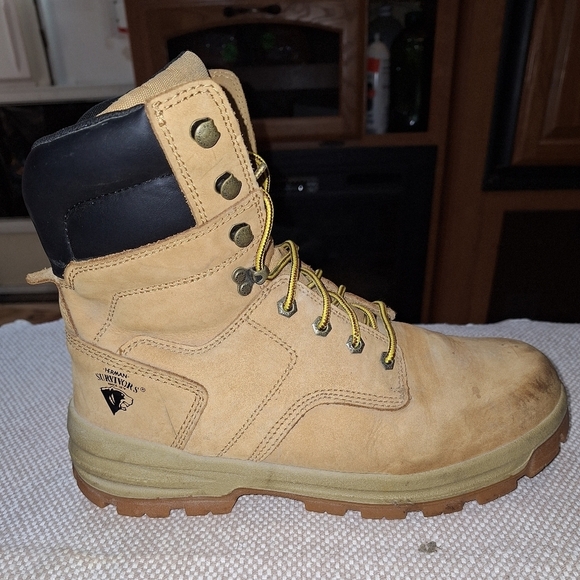 A pair of Herman Survivors leather boots in a men's size 11.5 Wide. Safety Toe. - Picture 9 of 12